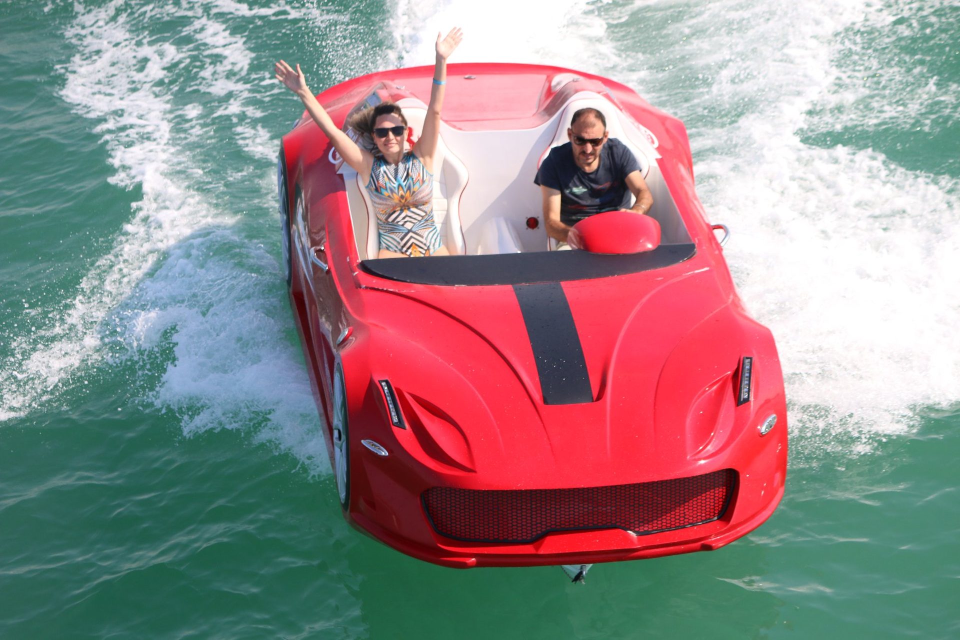 Yellow Super Water Car top-down aerial shot showing supercar body on UAE waters