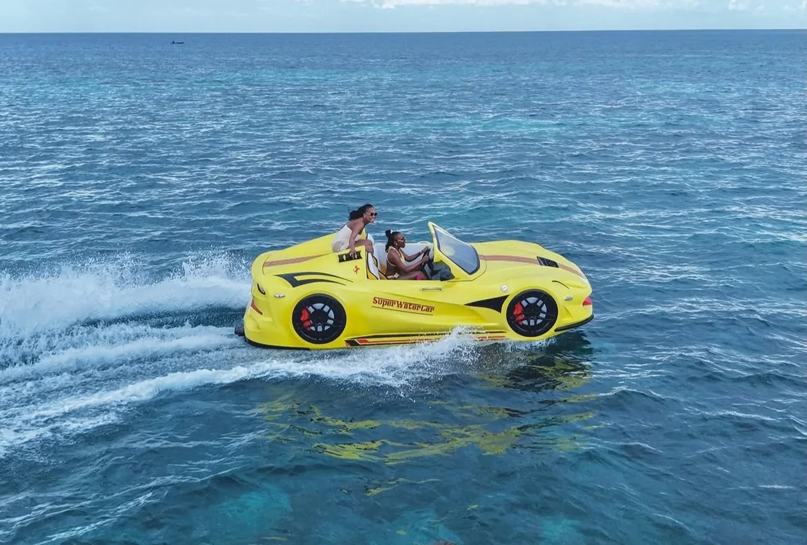 Yellow Super Water Car cruising across clear blue ocean water