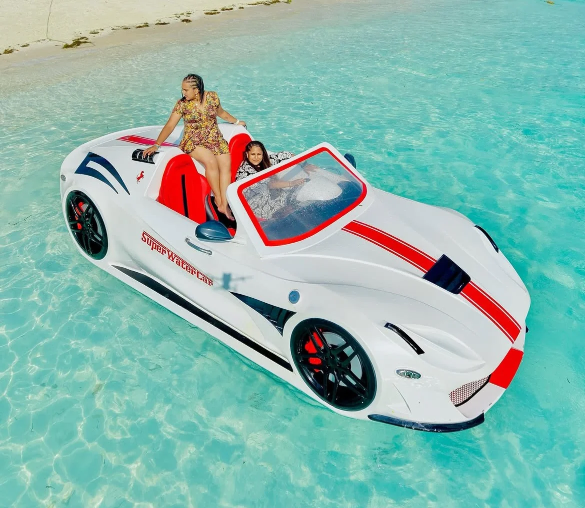 White and red Super Water Car photographed from above on turquoise water