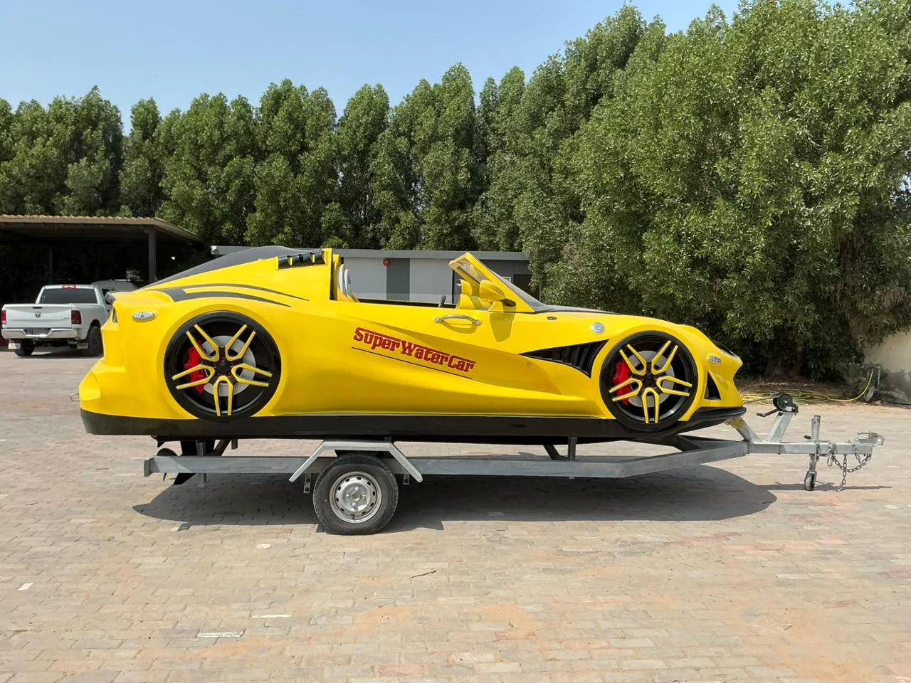 Yellow Super Water Car on a transport trailer at the UAE factory
