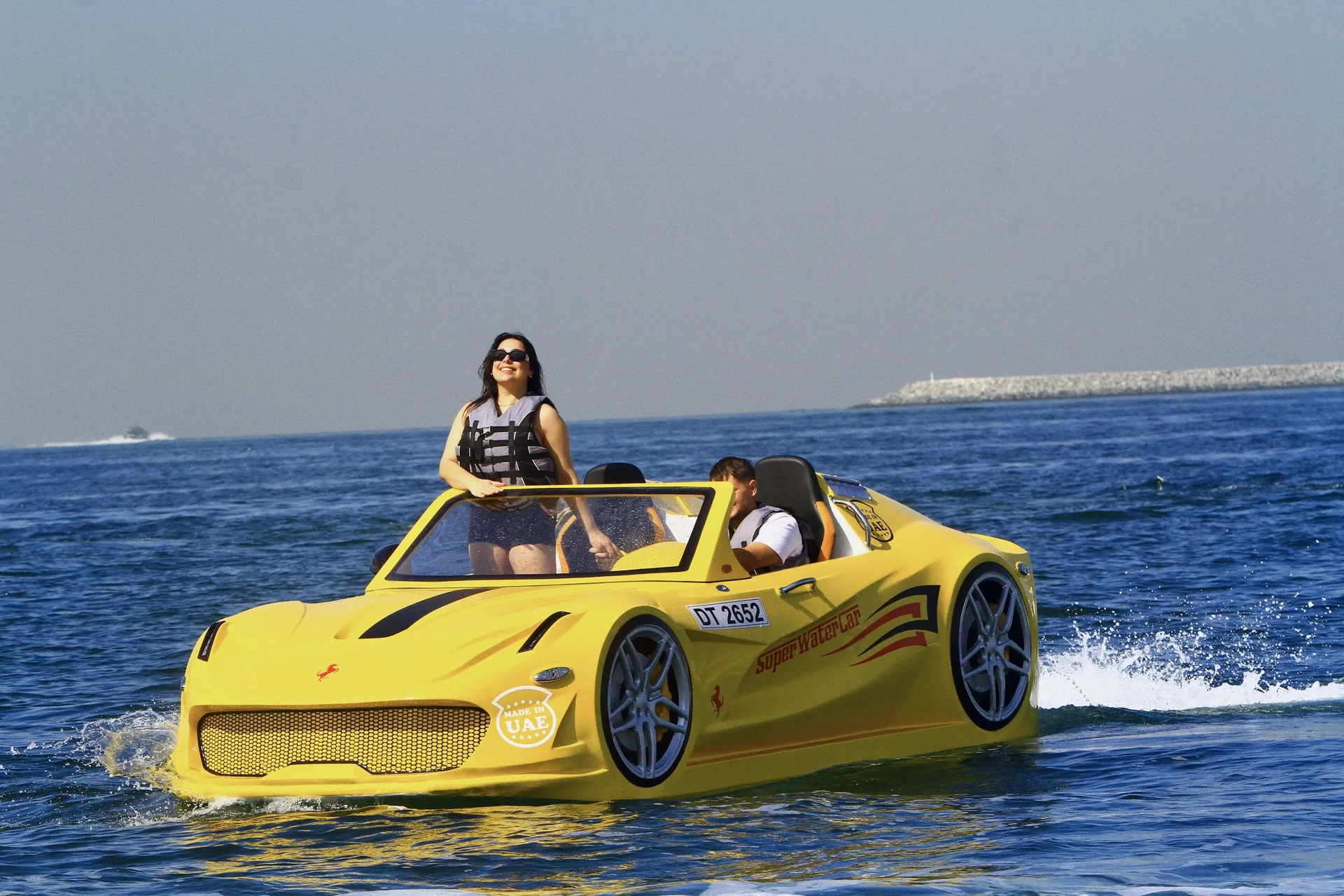 Yellow Super Water Car driving through blue water
