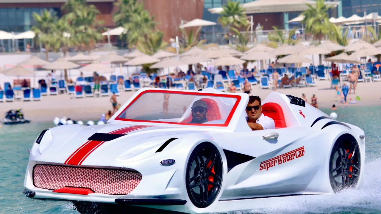 White Super Water Car at speed near the beach